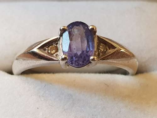 18ct White gold with large approx .75 carat Tanzanite solitaire ring with 2 diamonds each side