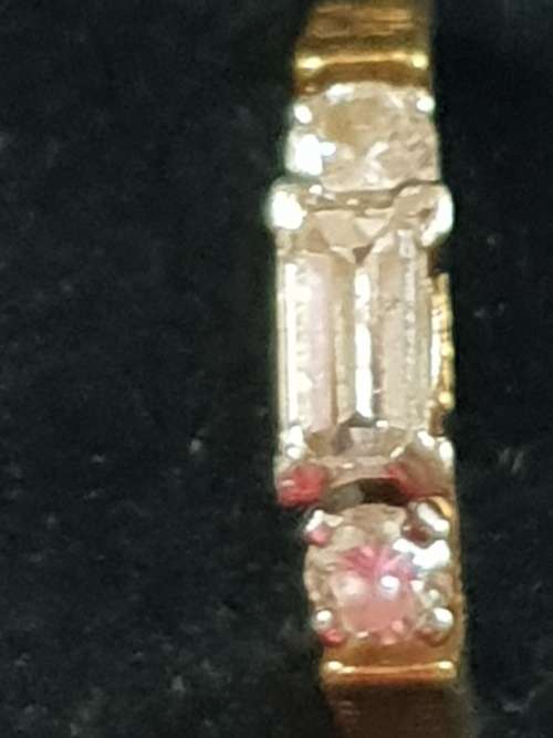 Genuine 18ct and 1/2 carat straight baguette cut Diamond Ring with 2 round cut diamond either side