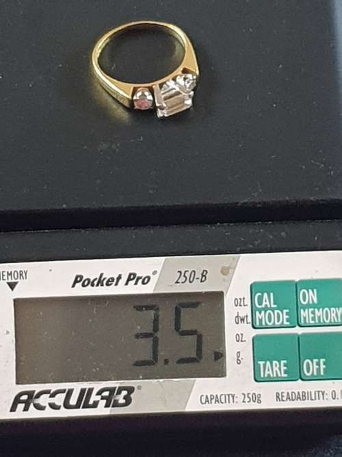 Genuine 18ct and 1/2 carat straight baguette cut Diamond Ring with 2 round cut diamond either side