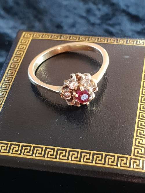 Vintage and hallmarked 18ct yellow gold ,diamond and Ruby ring