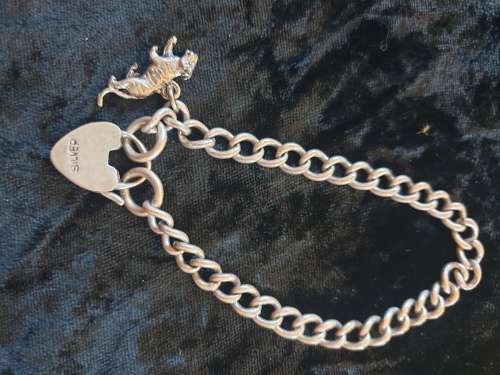 Heavy Sterling Silver bracelet with padlock and lioness charm-reduced