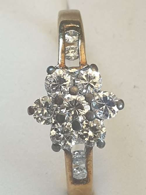 9CT yellow gold and Diamond flower ring hallmarked