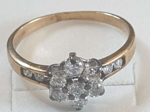 9CT yellow gold and Diamond flower ring hallmarked