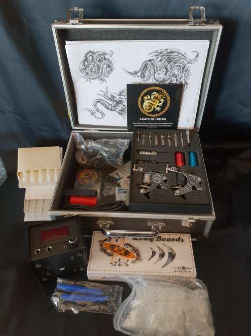 Tattoo Kit -2 guns in aluminium case still sealed needles and nozzlesandLearn to tattoo DVD etc