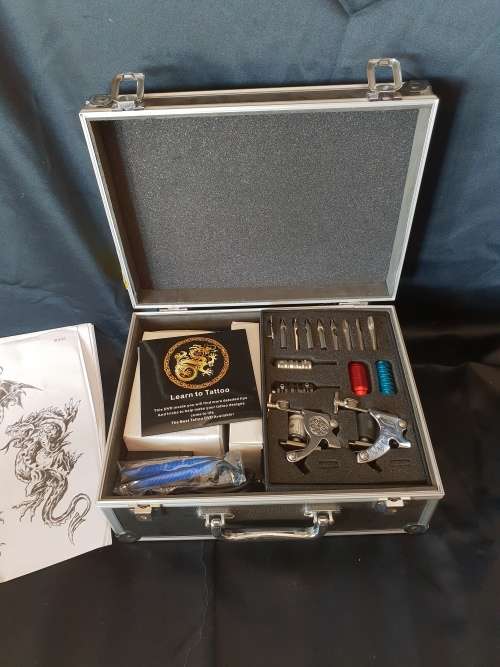 Tattoo Kit -2 guns in aluminium case still sealed needles and nozzlesandLearn to tattoo DVD etc