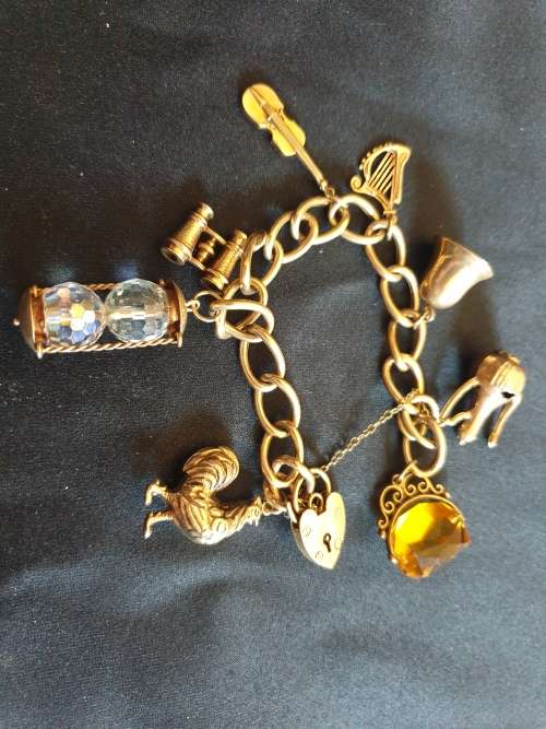 Stunning antique 9ct gold charm bracelet with each charm individually hallmarked