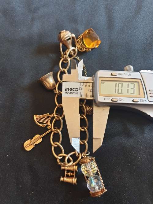 Stunning antique 9ct gold charm bracelet with each charm individually hallmarked
