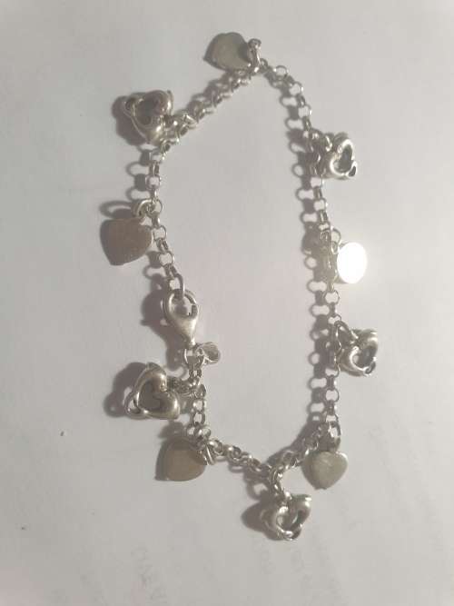 Sterling Silver cute bracelet with hearts and dolphins