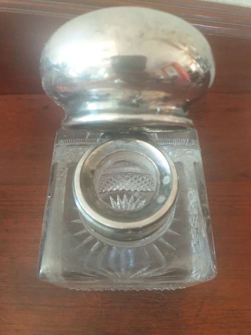 Antique Solid silver and cut glass very heavy inkwell with a lions head embossed on the lid