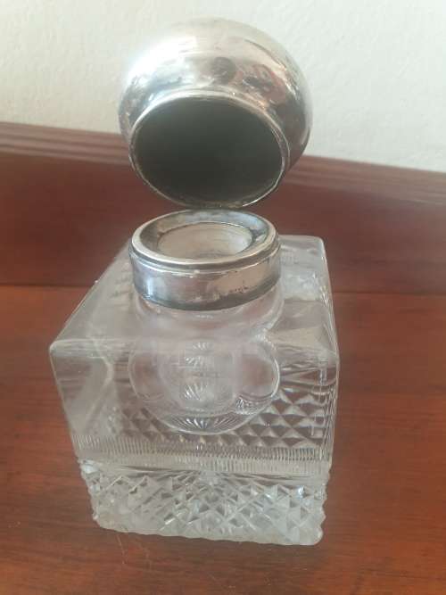 Antique Solid silver and cut glass very heavy inkwell with a lions head embossed on the lid