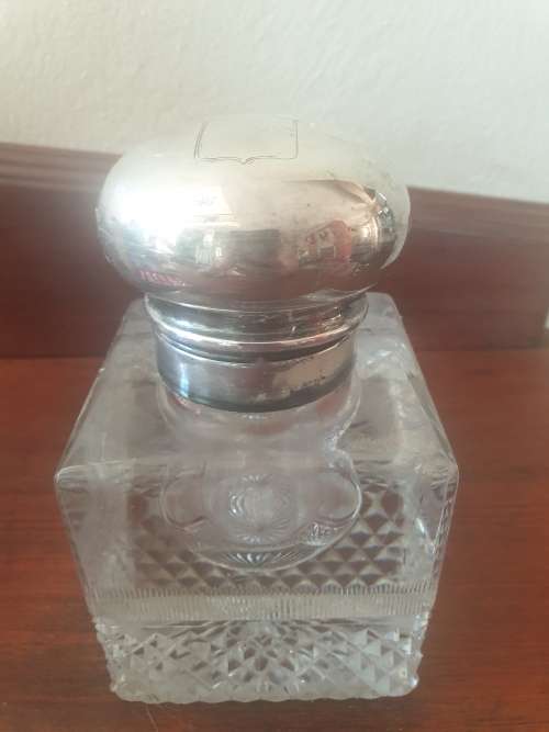Antique Solid silver and cut glass very heavy inkwell with a lions head embossed on the lid