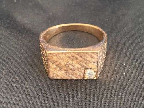 9ct gold men`s heavy gold ring with a .10 carat diamond