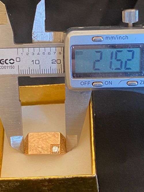9ct gold men`s heavy gold ring with a .10 carat diamond