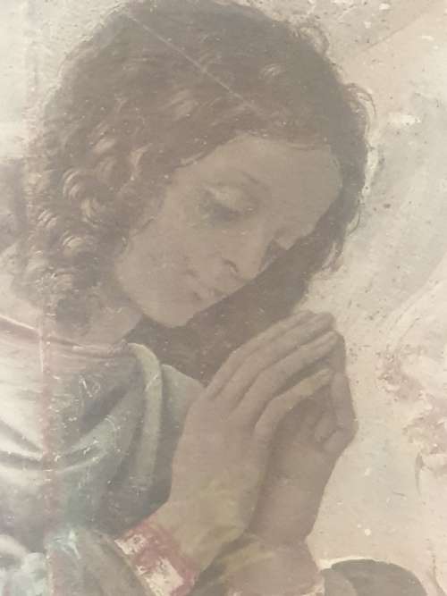 Madonna praying in wooden frame