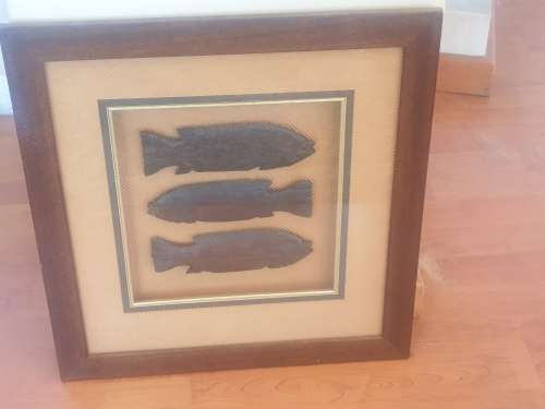 3 wooden fish in frame