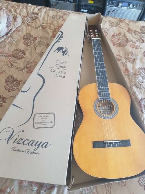 Brand New Vizcaya full size classic guitar -natural wood colour