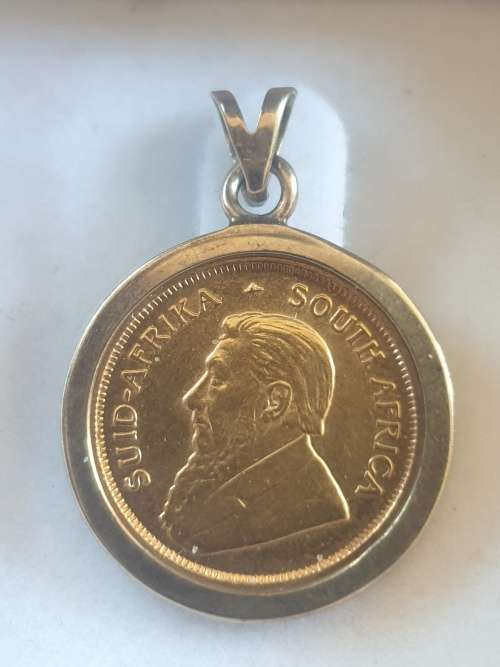 1/10th Kruger rand coin set on a 9ct gold pendant-Year 1994