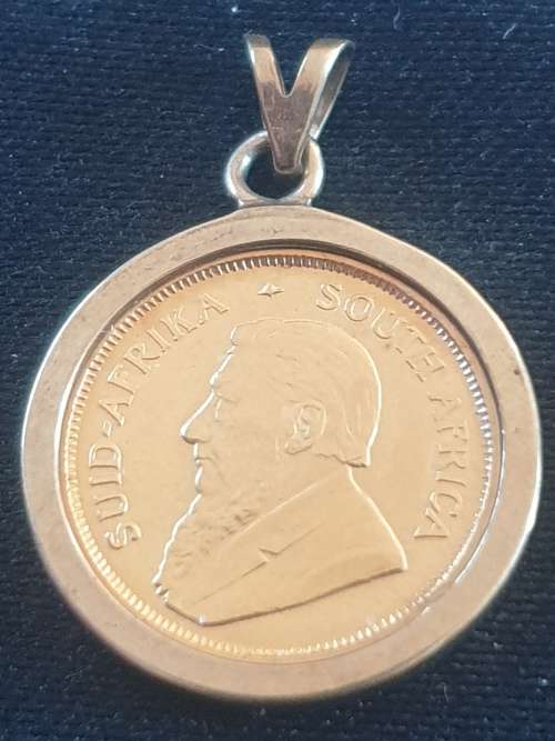 1/10th Kruger rand coin set on a 9ct gold pendant-Year 1994