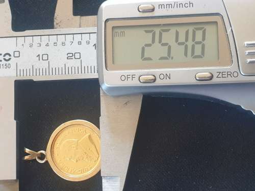 1/10th Kruger rand coin set on a 9ct gold pendant-Year 1994