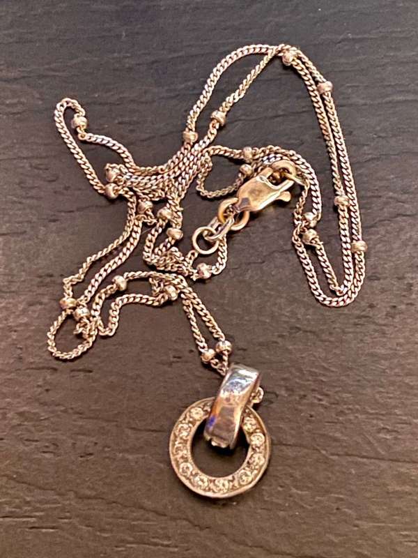 9ct white gold chain with a 9ct white gold and diamond Halo pendant