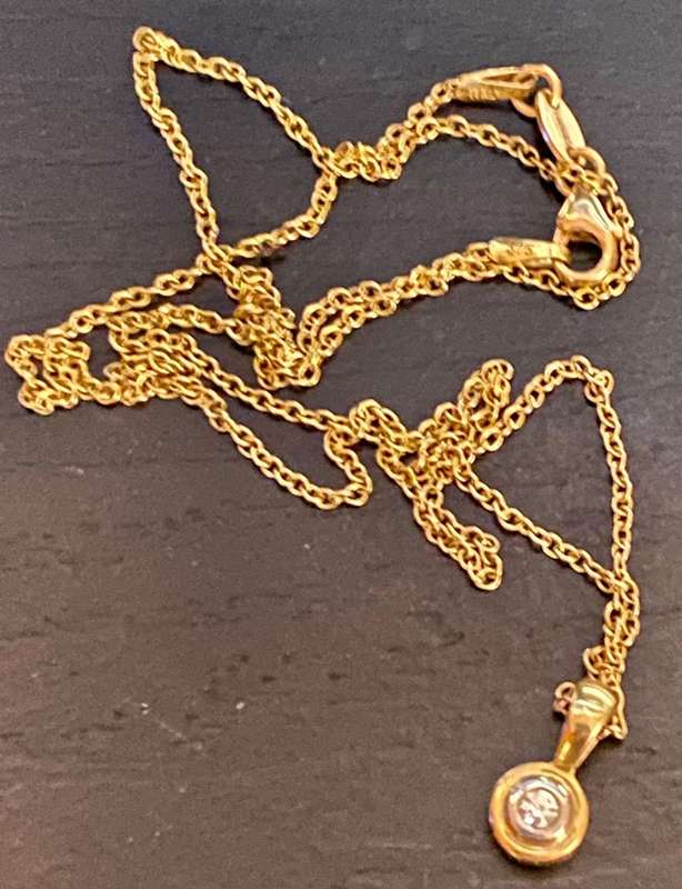 9ct yellow gold and approx 0.25 carat diamond necklace and pendant