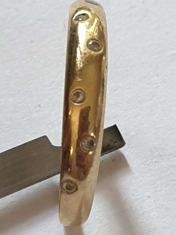 9 ct gold ring with 6 small Cubic Zirconia`s