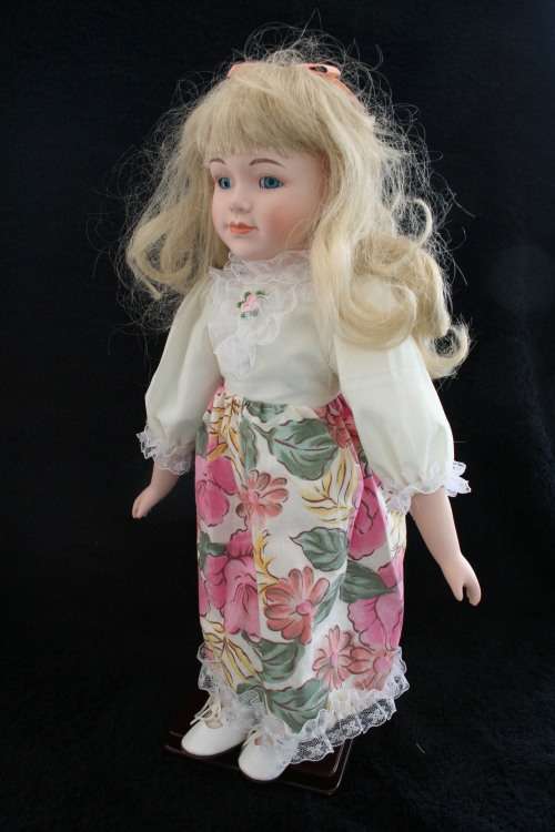 PORCELAIN BOY/GIRL  DOLL--FULLY DRESSED WITH STAND