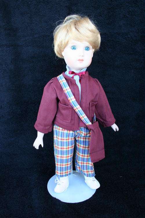 PORCELAIN BOY/GIRL  DOLL--FULLY DRESSED WITH STAND