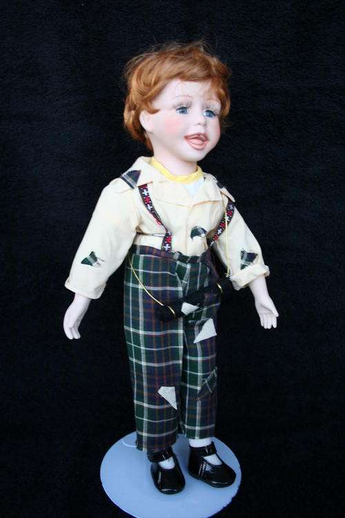 PORCELAIN BOY/GIRL DOLL--FULLY DRESSED WITH STAND