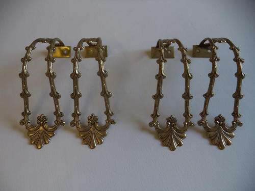 TWO PAIRS BRASS TIE BACKS