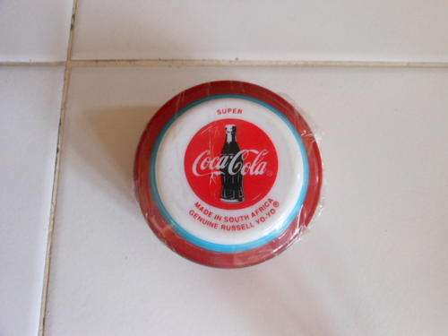 SOUTH- AFRICAN , COCA COLA YO YO --NEW IN ORIGINAL PACKAGING.