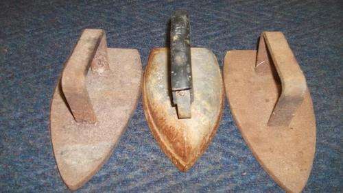 A collection of 3 very old irons