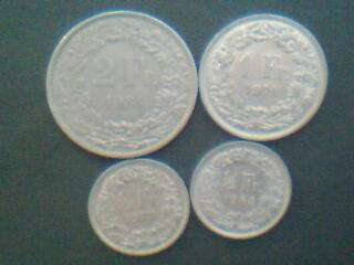 A collection of 4 swiss FR coins