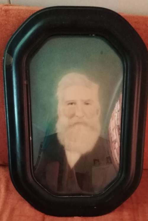 An Antique Bubble Glass Frame Portrait with Original Photograph