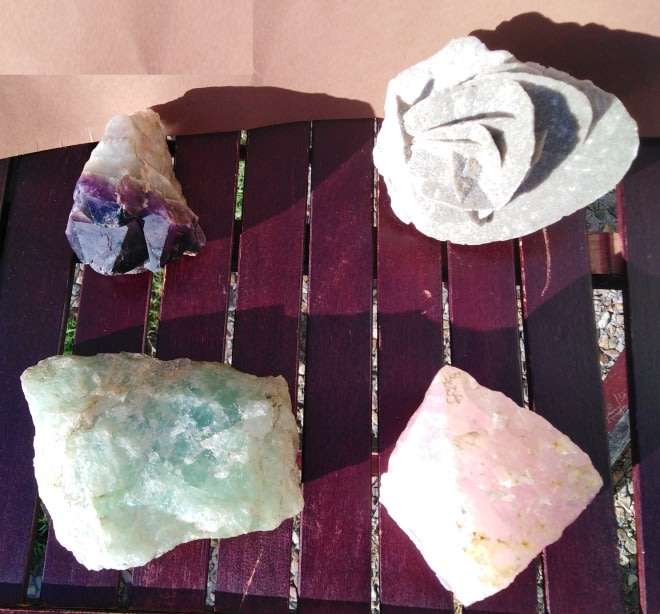 A Collection of 4 Rough Chrystal Rocks including Green Quartz and Rose Quartz