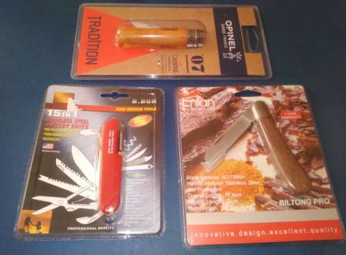 A Collection of Three Different Knives Still Sealed in Blister Packs