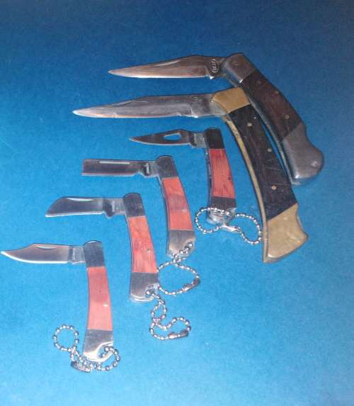 A Collection of Seven Folding Knives including 1 set of KTK Mini Knives