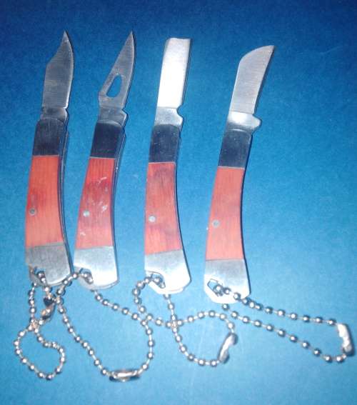 A Collection of Seven Folding Knives including 1 set of KTK Mini Knives