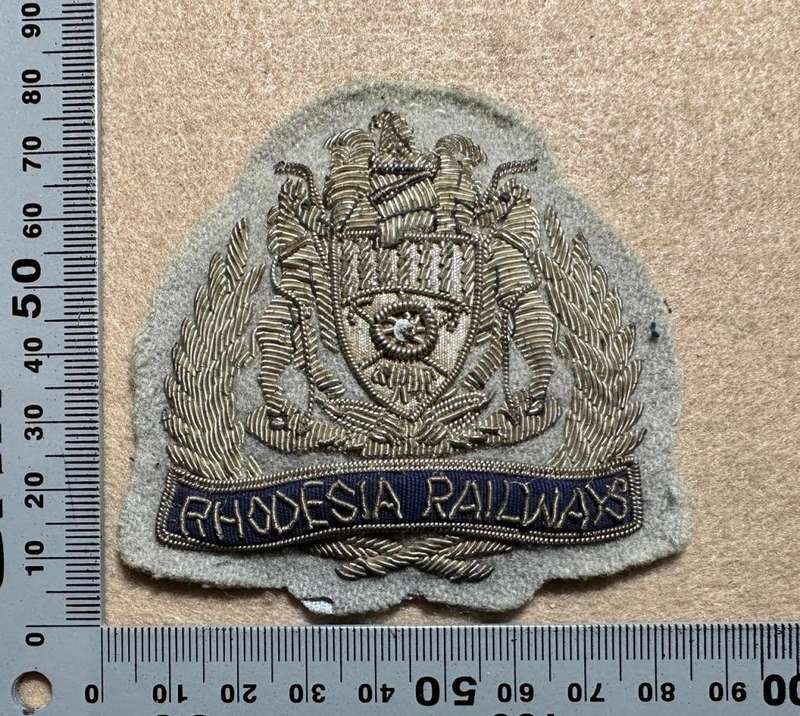 Rhodesian Railways - BULLION SILVER ON GREY CAP BADGE