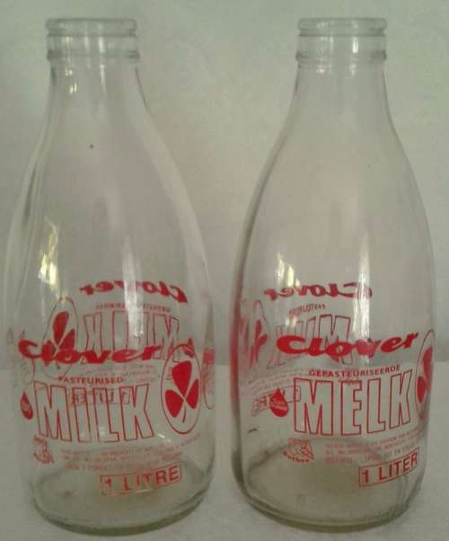 Two Old Clover Milk Bottles which were delivered in the 70's / 80's