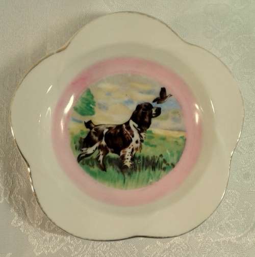 Unusual small vintage trinket bowl with a Spaniel and Duck..Pink and gold detail