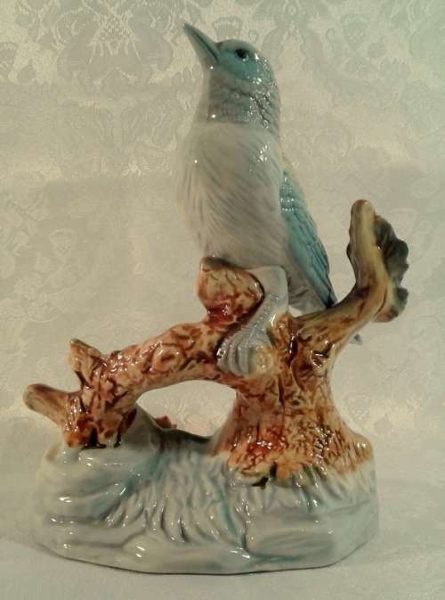 Impressive porcelain Bird on a branch