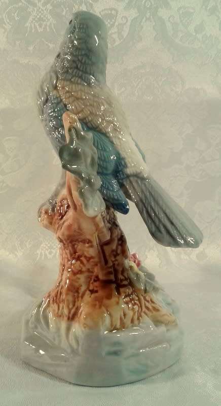 Impressive porcelain Bird on a branch