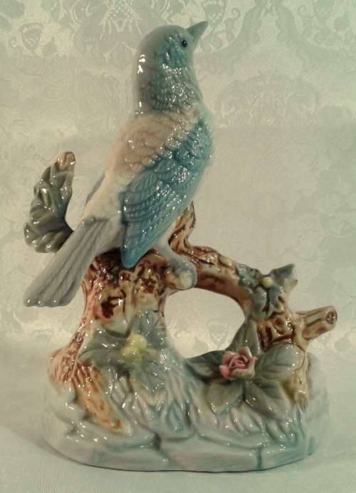Impressive porcelain Bird on a branch