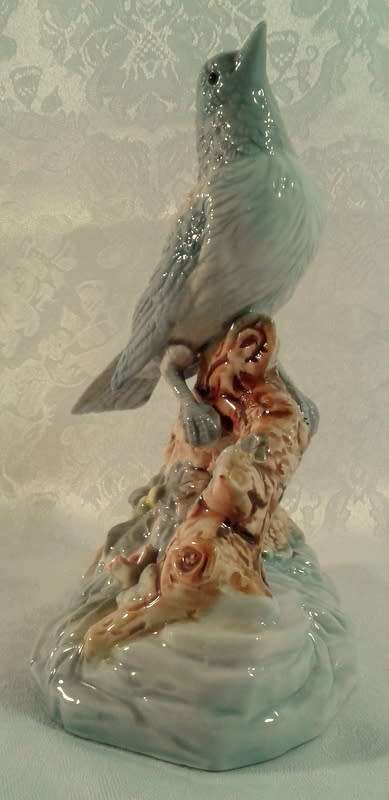 Impressive porcelain Bird on a branch