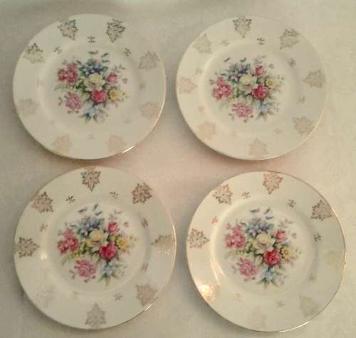 Four pretty vintage cake plates with gold details and flowers