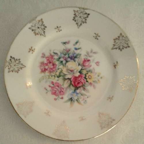 Four pretty vintage cake plates with gold details and flowers
