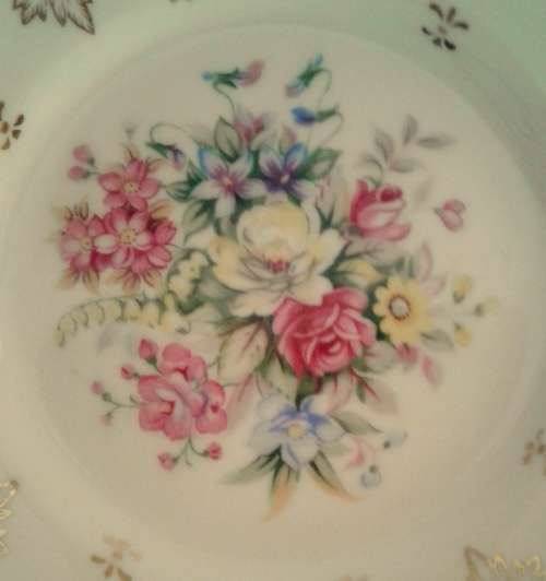 Four pretty vintage cake plates with gold details and flowers