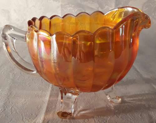 Beautiful bright orange coloured vintage carnival glass milk jug