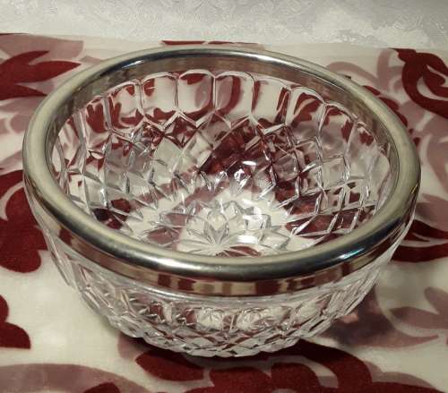 Sought after small glass bowl with EP rim. Stamped England on the inside.